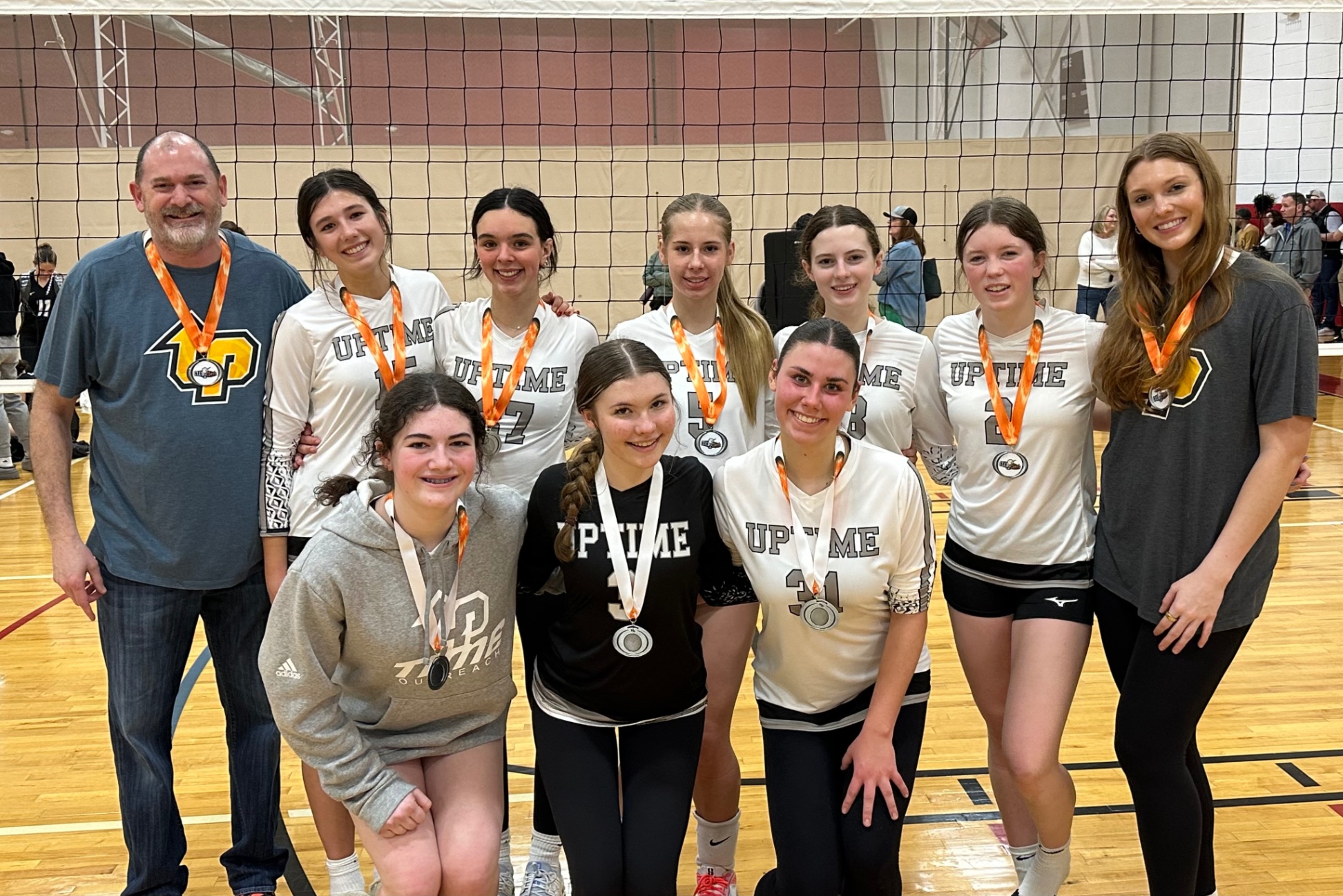 Volleyball team with medals